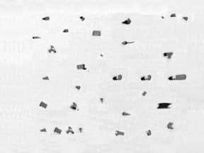 Oxide inclusions in steel - metallographic defect analysis Oxide inclusions in steel microstructure showing common metallographic sample preparation issues and defects in microstructural analysis